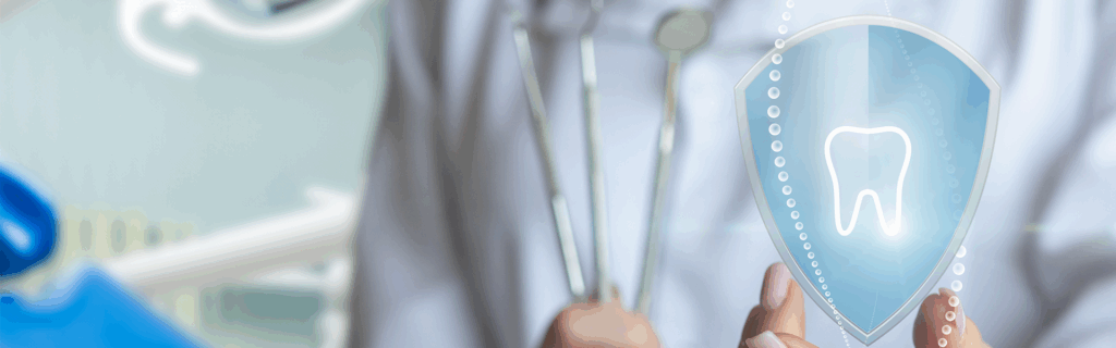 Person's hand holding dental graphic of a tooth